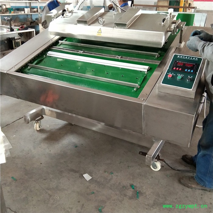 义康牌GDS-1000型连续式真空包装机  羊蹄真空包装机  羊杂滚动式包装机图2